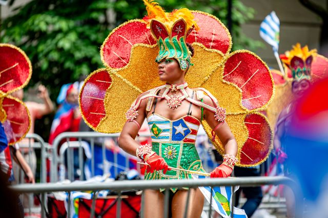 People in elaborate costumes celebrate the Rio Carnaval