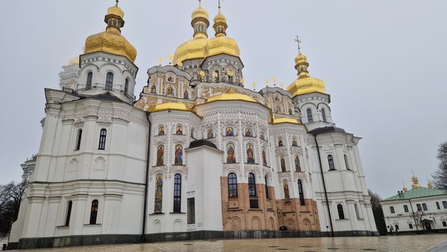 Kiev-Pechersk Lavra against the sky with clouds autumn. Kiev, Ukraine