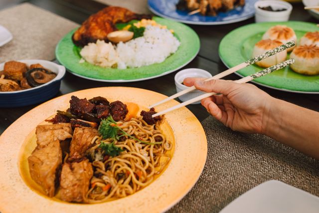 food using chopsticks