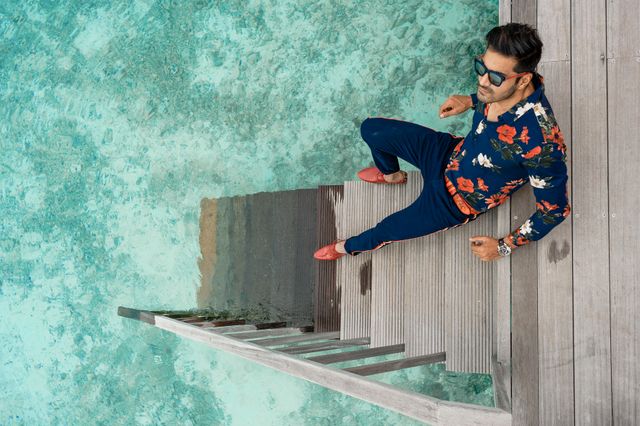 Man wearing chinos as travel outfits for men