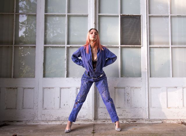 Woman wearing a jumpsuit with heels - travel outfits for women
