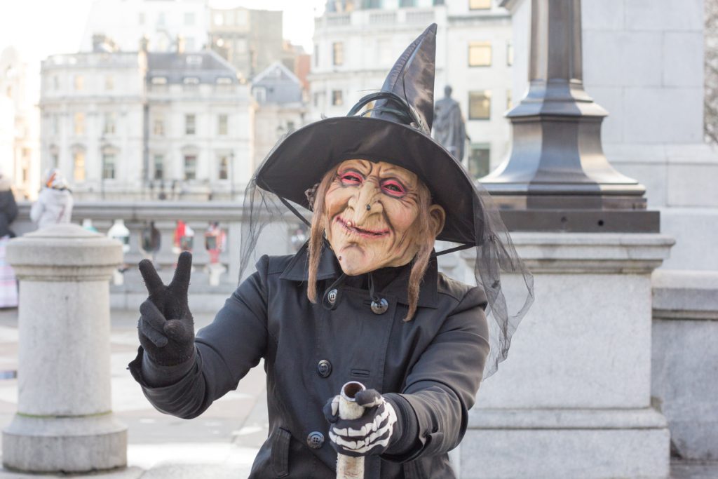 A person in a witch costume - harry potter tour
