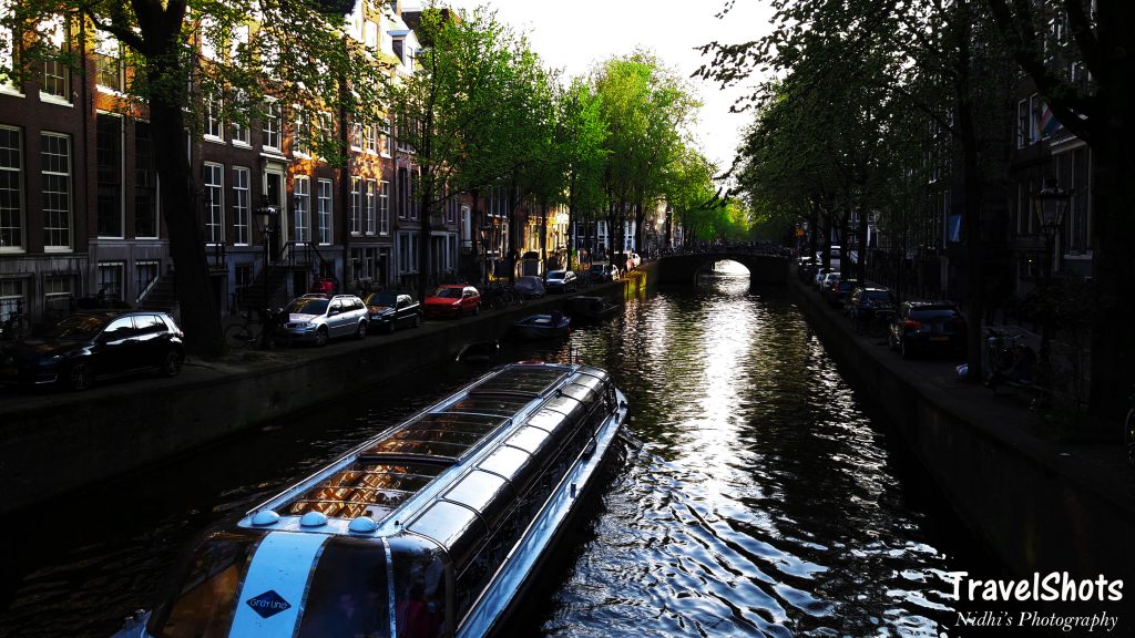 A boat on a canal in Amsterdam