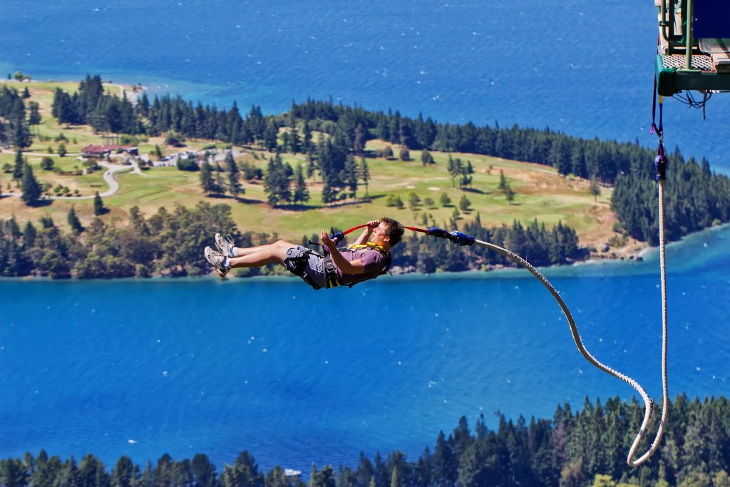 Man taking the plunge from a Ledge bungy jumping, Queenstown,New Zealand