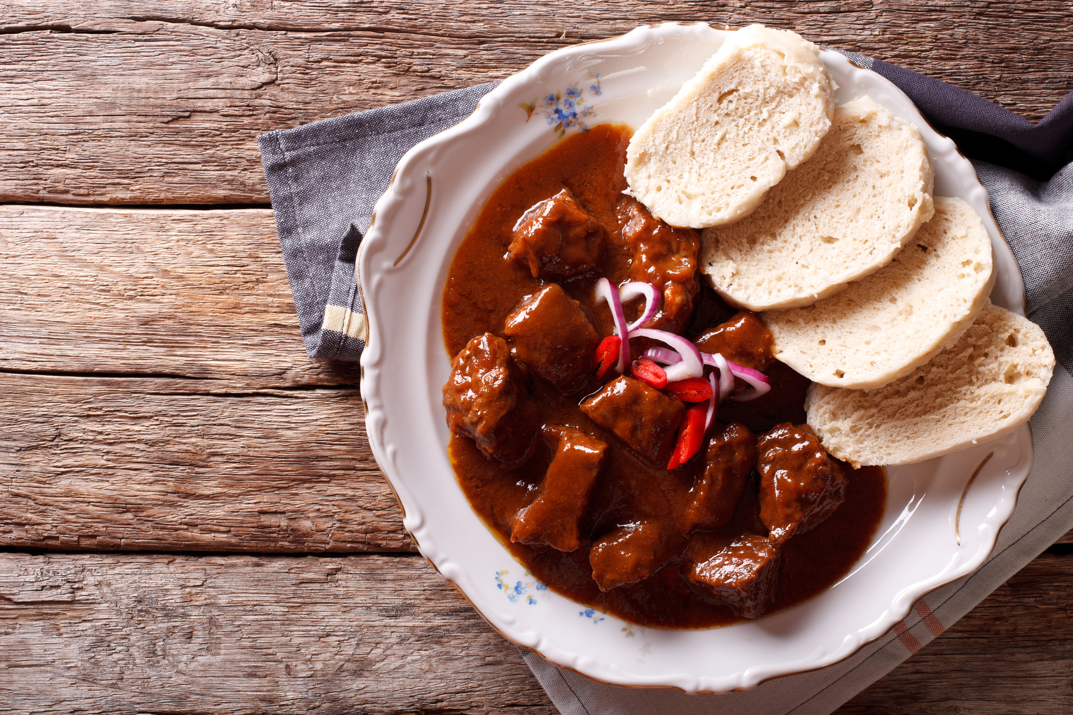 Homemade Hot Czech Goulash With Knodel In A Plate Close Up Homemade Hot Czech Goulash With Knodel In A Plate Close Up