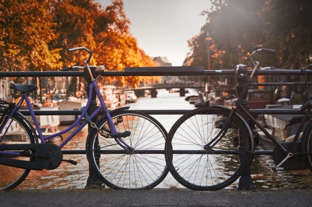 Two bikes on a bridge in Amsterdam