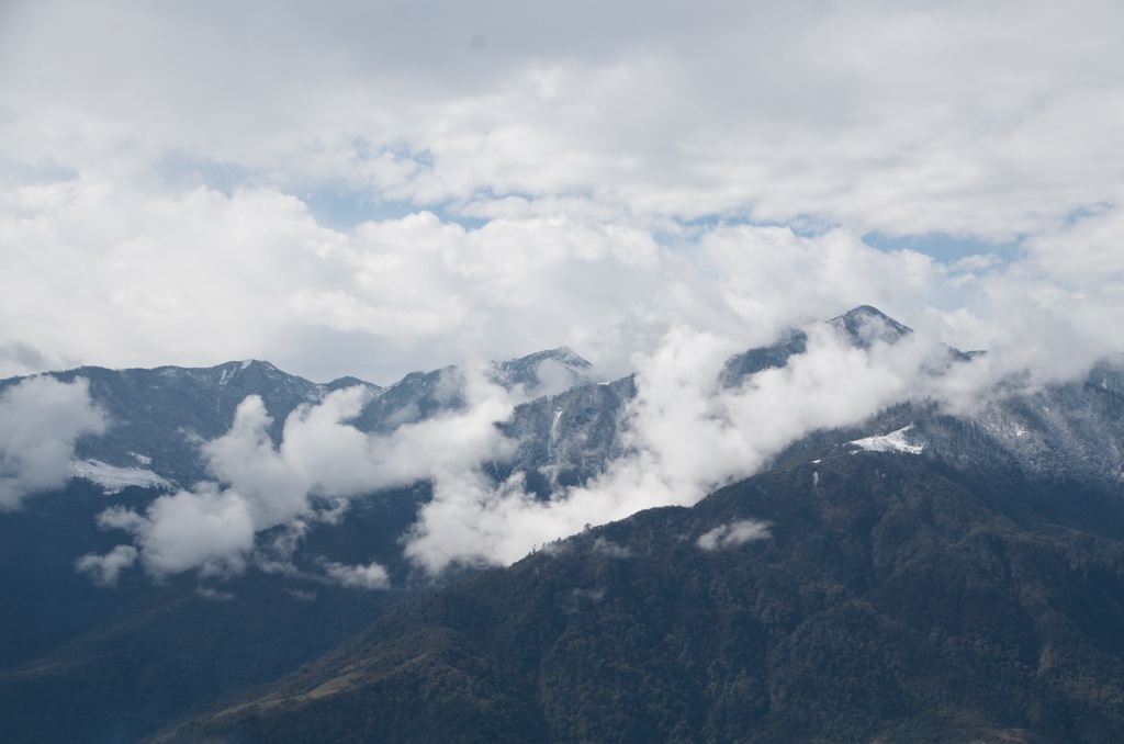 Low hanging clouds over the mountains in Tawang