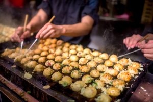 Cooking takoyaki, one of the most popular snacks of Japan