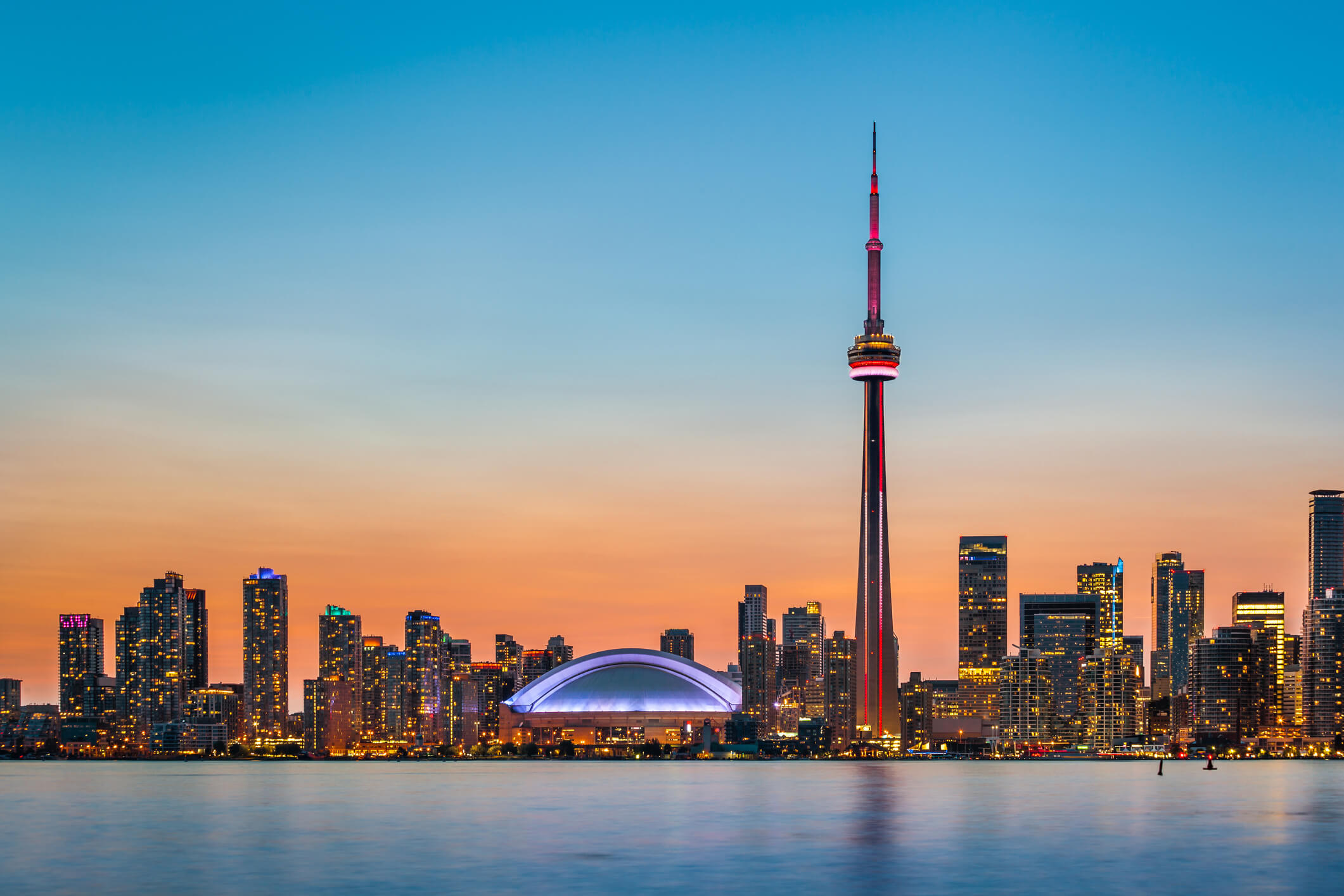 Toronto skyline at twilight with the CN Tower standing tall - Toronto and Quebec, vegan-friendly cities