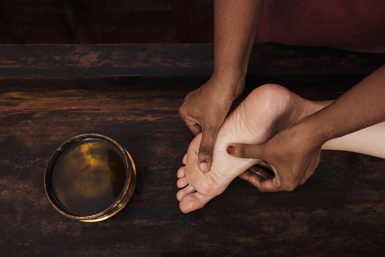 Kerala Ayurvedic massages, Ayurvedic foot massage with oil in a traditional style