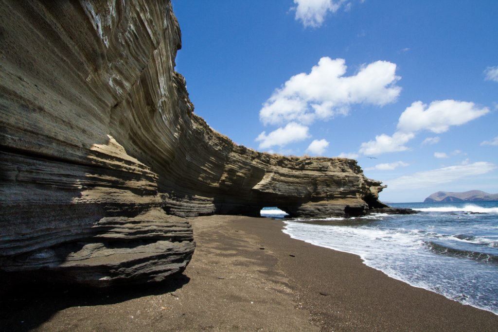 Coastal sandstone cliffs showing geological features, Santiago Island, Galapagos Islands, Ecuador