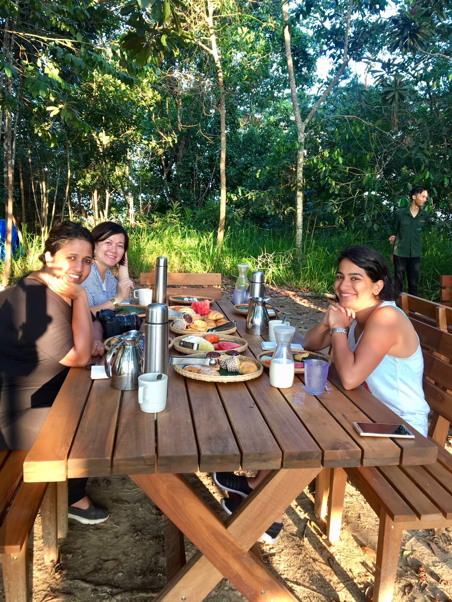 People sitting at an outdoor breakfast table - breakfast with a view