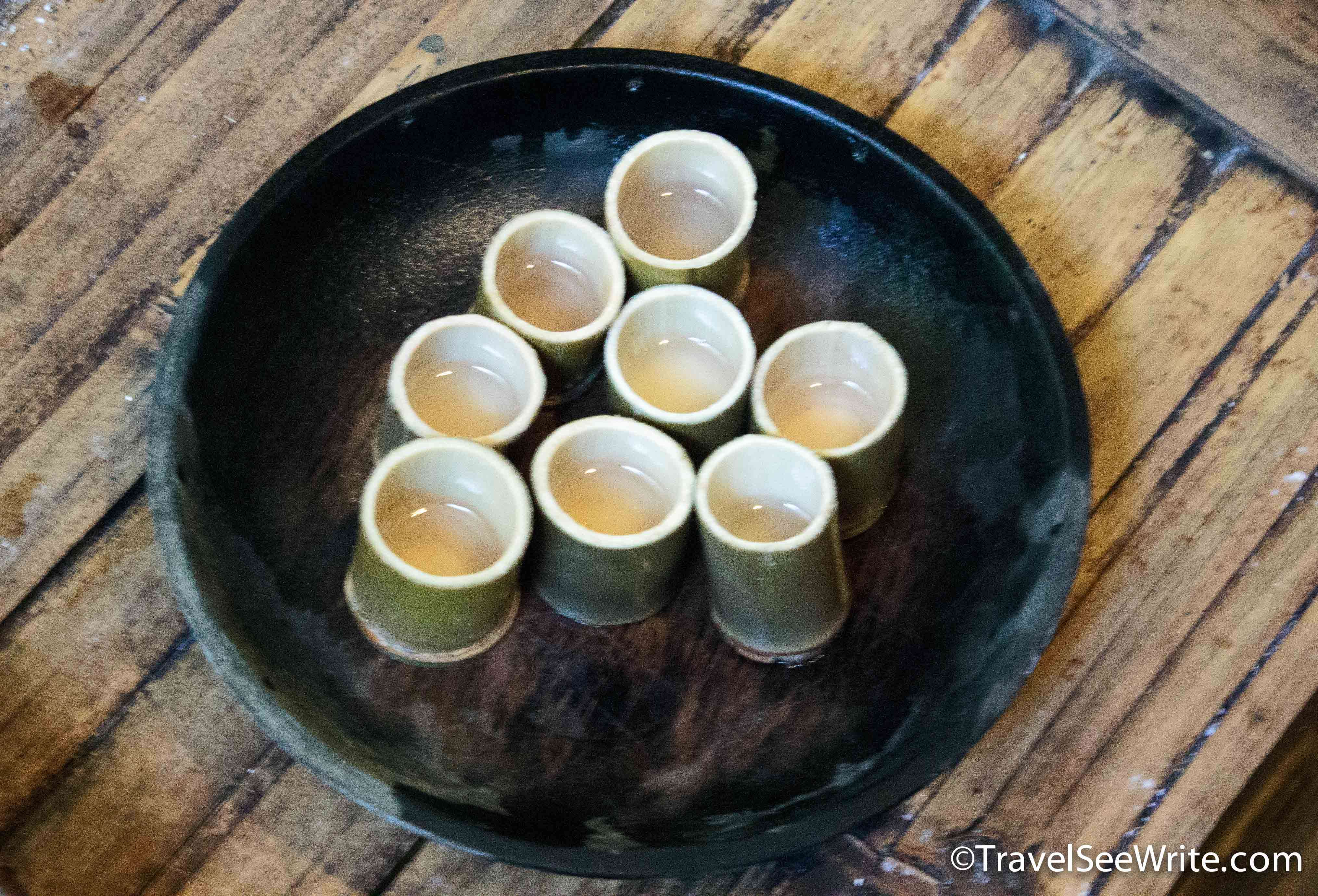 Homemade rice wine in bamboo glasses at Mari Mari Cultural village - southeast asia travel