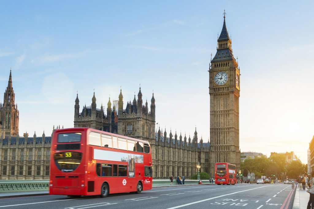 Westminster palace and Big Ben and traffic on Westminster bridge in foreground