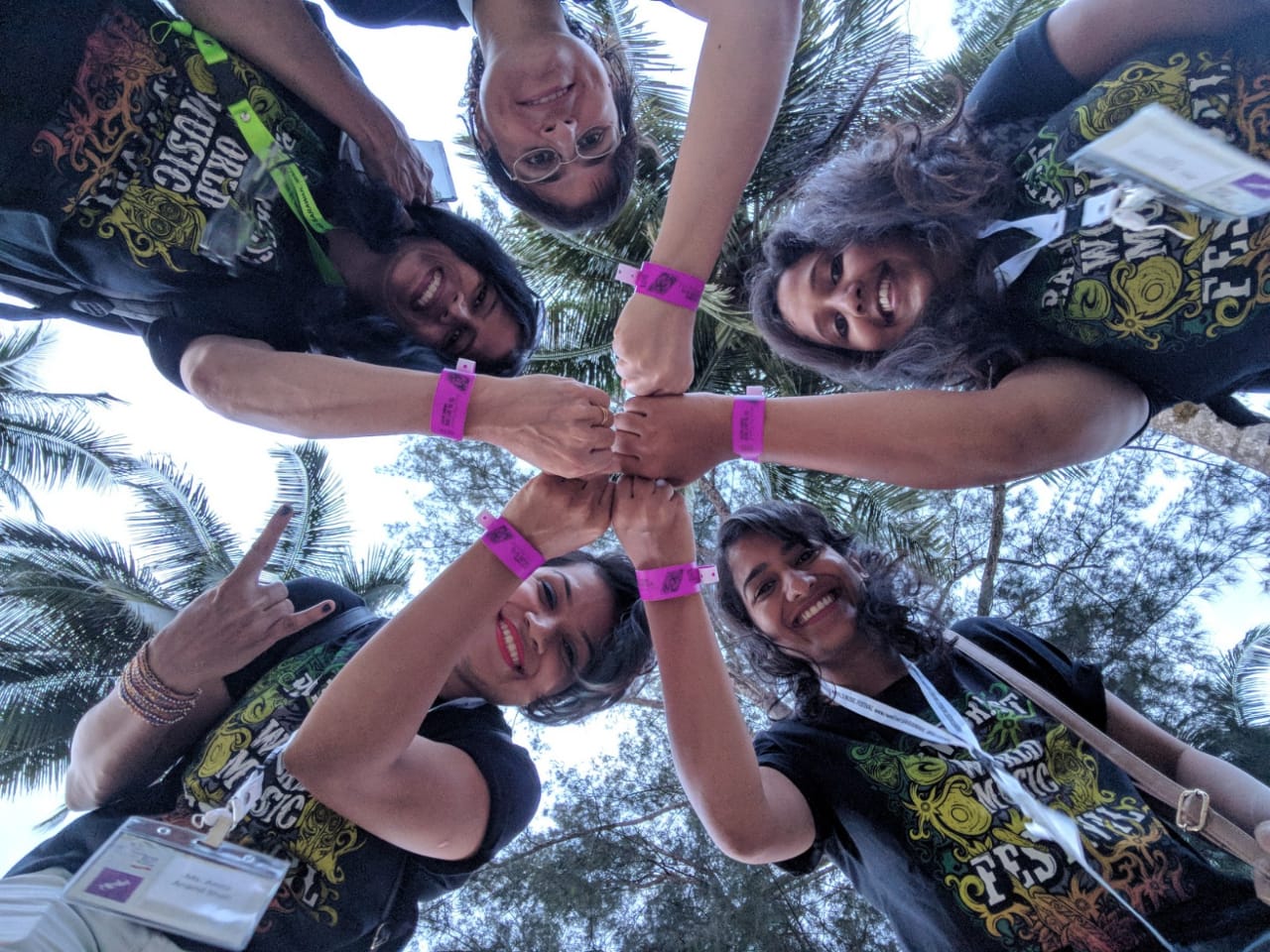 women posing with their hands showing entry bands - Rainforest World Music Festival (RWMF) 2018