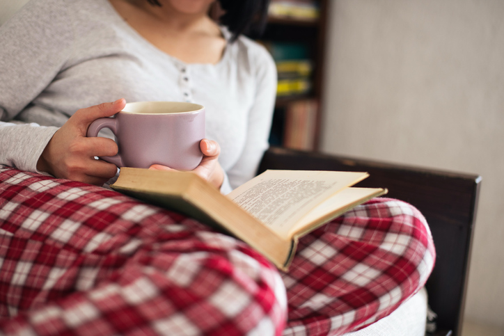 Drinking tea and reading book