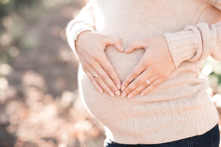 Warm sweater as maternity clothes for winter travel