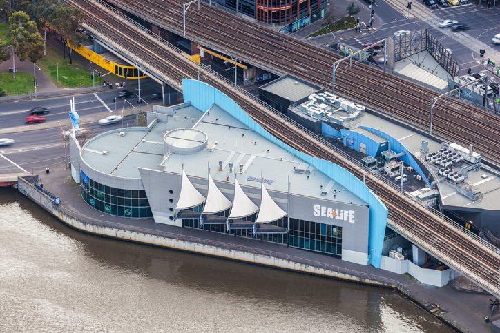 Aerial view of Melbourne Sea Life Aquarium building on the bank of Yarra River