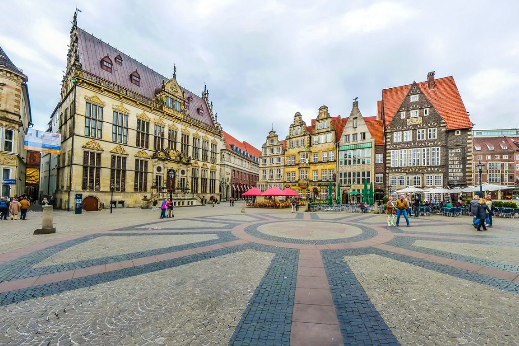 Ancient Bremen Market Square in the centre of the Hanseatic City of Bremen with view on The Schuetting (former guild house) and famous Raths-Buildings, Germany