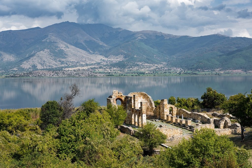 Landscape with the ruins of the Basilica of Agios (Saint) Achillios at the Small Prespa Lake in northern Greece
