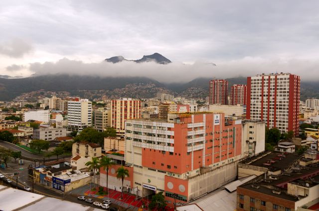 Captivating aerial view of Caracas with urban skyline and misty mountains in the background