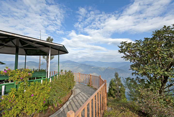 Himalayan view, Kalimpong, West Bengal, India. Rolling foothills and wide cloudscape in this Himalayan view from a quiet and tranquil viewpoint platform in Kalimpong, West Bengal, India