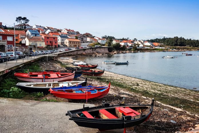 Fishing boats beached on Naval beach in Arousa Island, Galicia, Spain