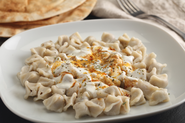 Turkish dumplings Manti with Greek yogurt and spices