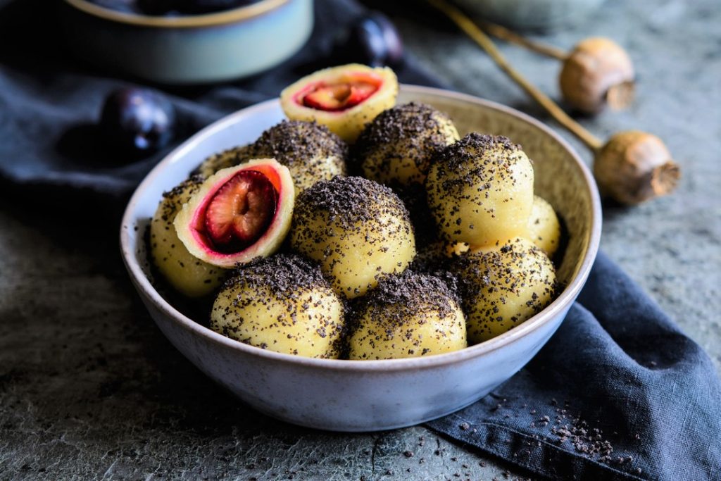 Traditional sweet plum dumplings with poppy seeds