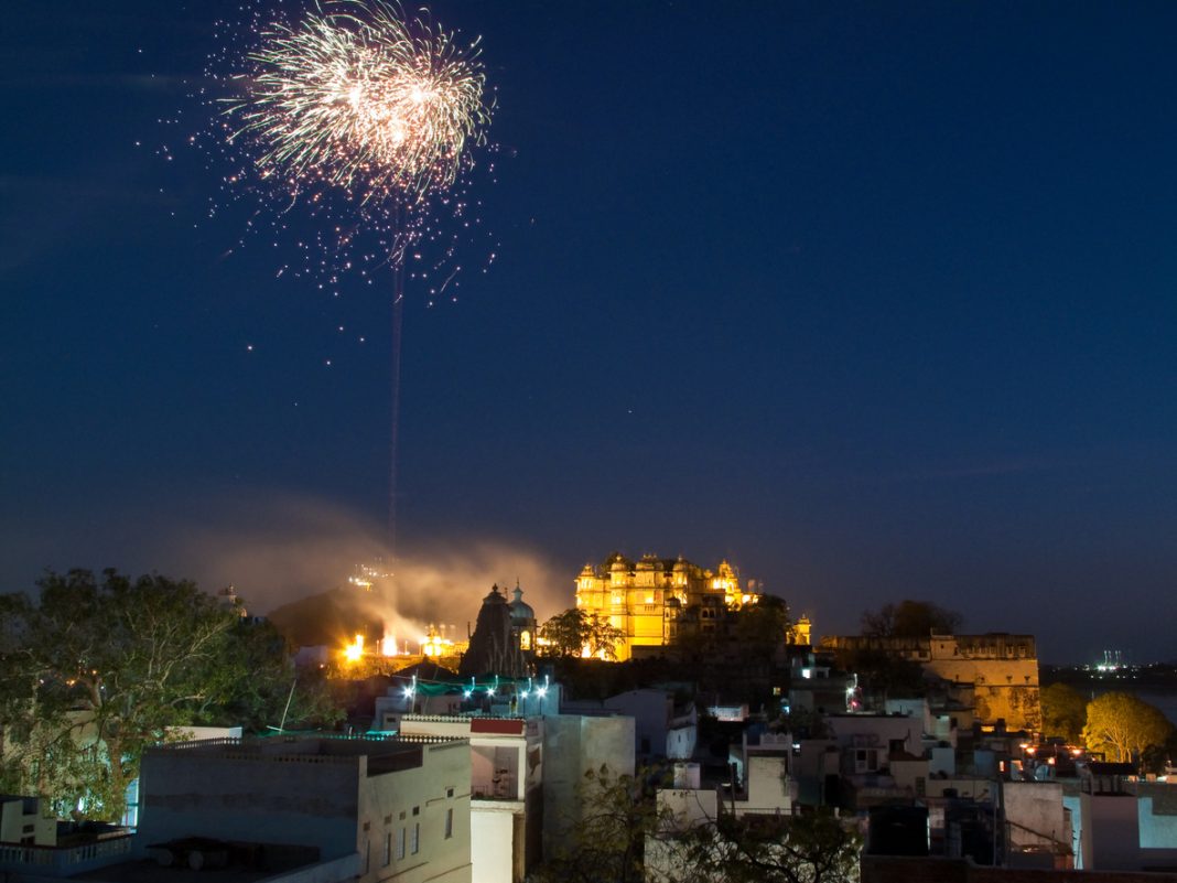 City Palace In Udaipur With Fireworks Before Holi Festival