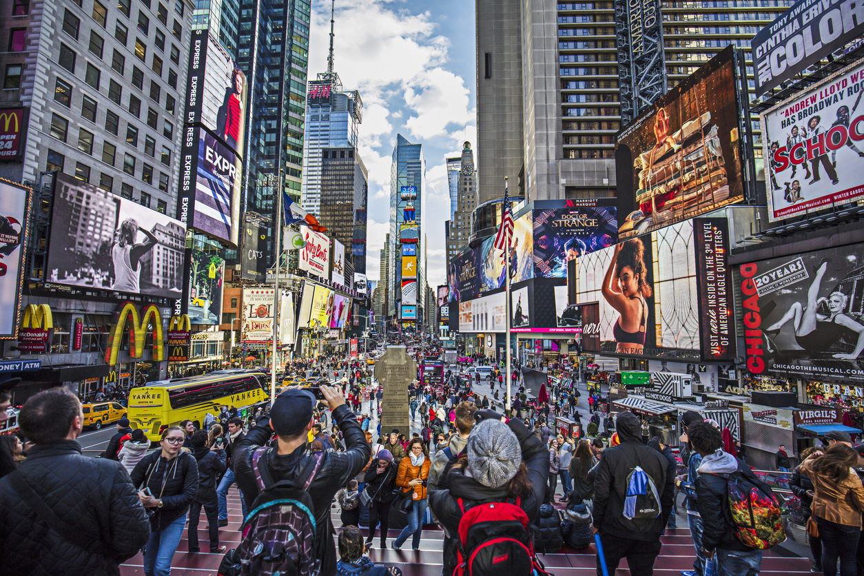 View of crowded Times Square in New York City, vegan-friendly cities