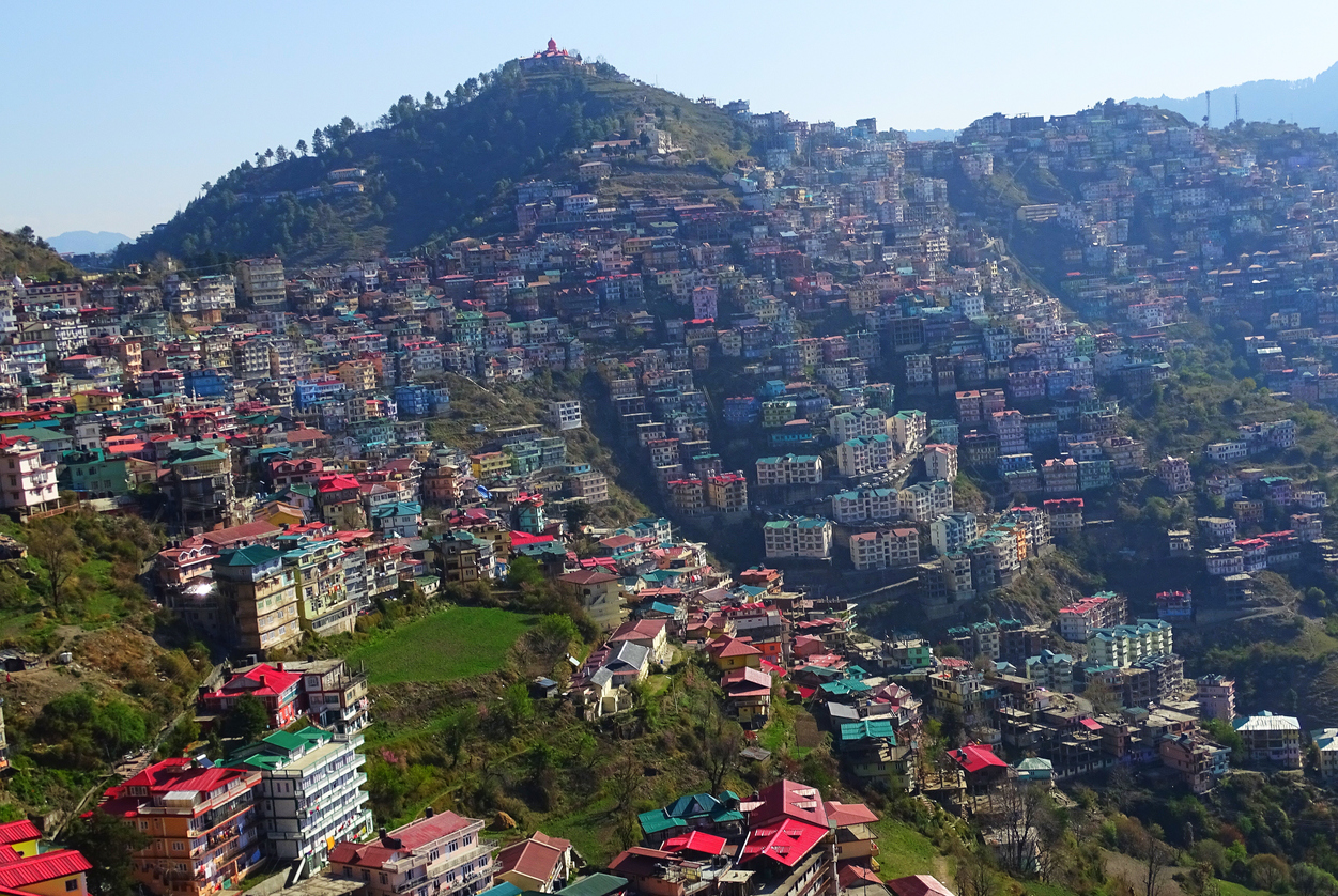 Manali's houses located on hills in state of himachal pradesh in a himalayan mountain range. Manali hotels and colorful houses on hills.