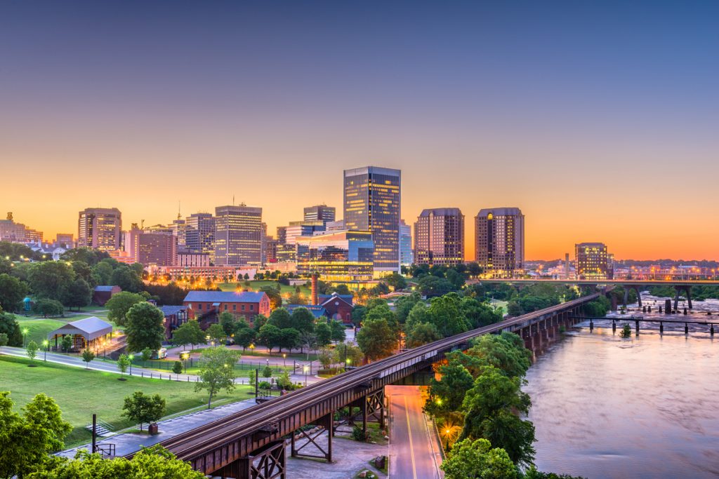 Richmond, Virginia, USA downtown skyline on the river at twilight.