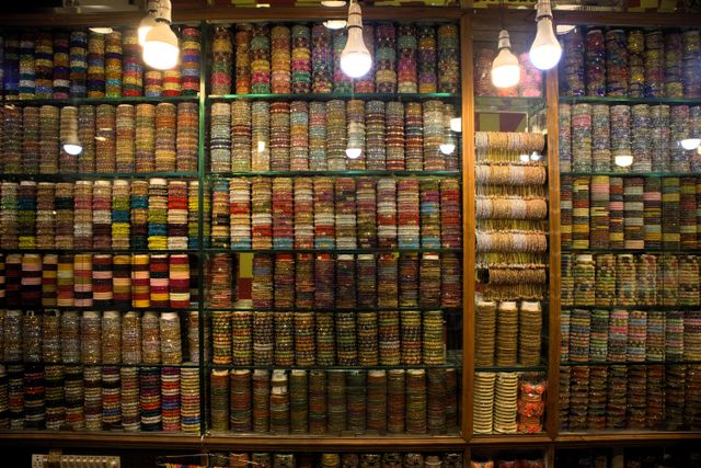 Shopkeeper selling bangles, Laad Bazaar or Choodi Bazaar. traditional markets in india