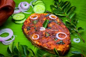Perfectly fried fish with garnish of onions and currey leaves.
