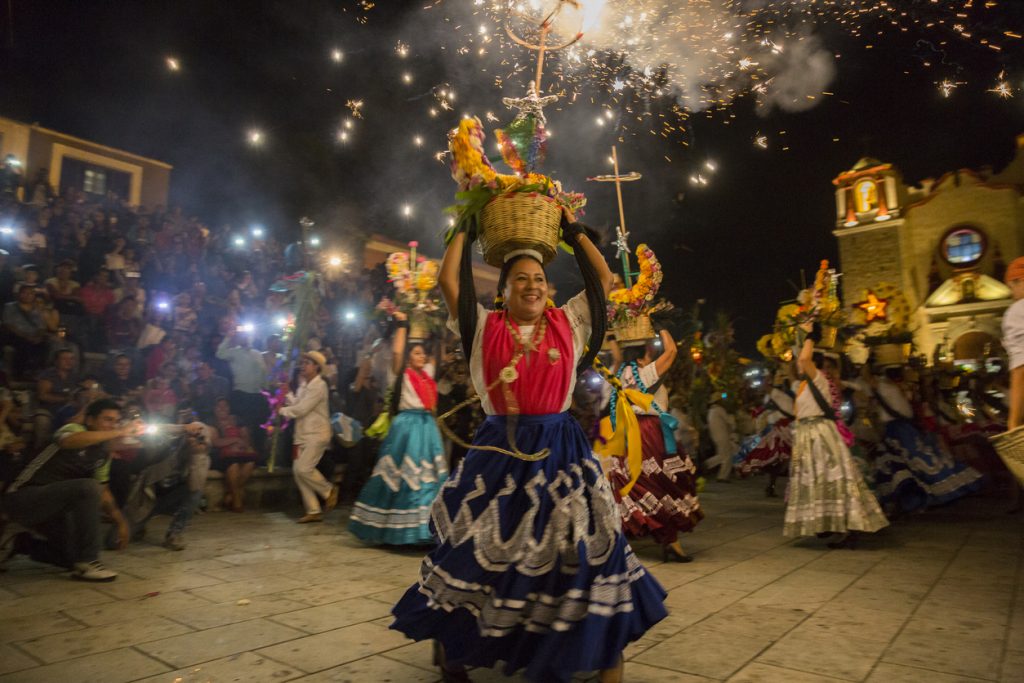 Women with China oaxaqueña traditional costume dancing for Guelaguetza celebration