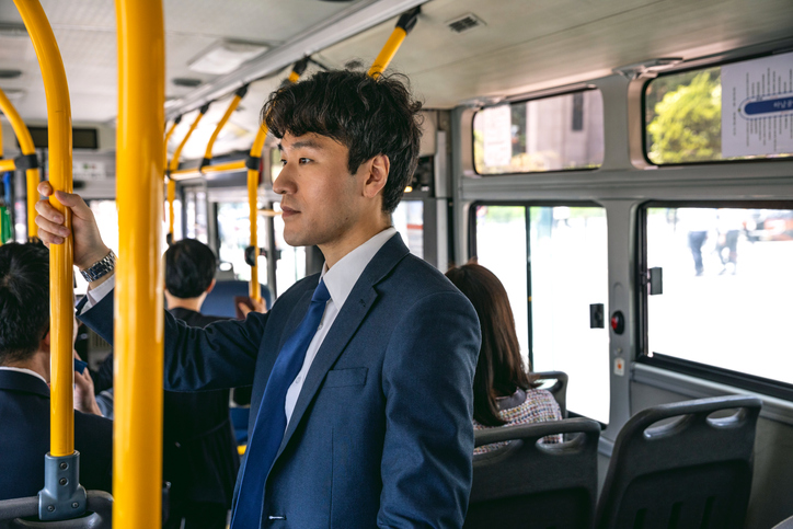 Businessman commuting by bus in Seoul - South Korea