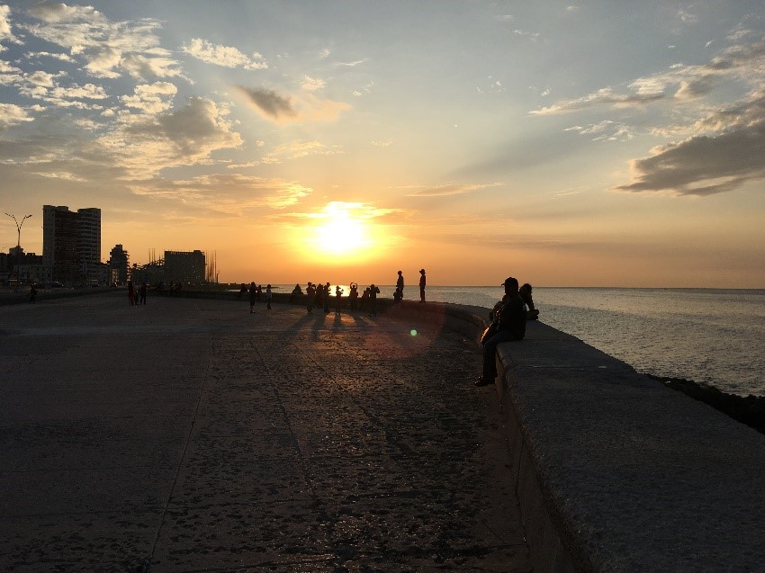 Sunset over the Malecon, a place where you can go dancing in Havana