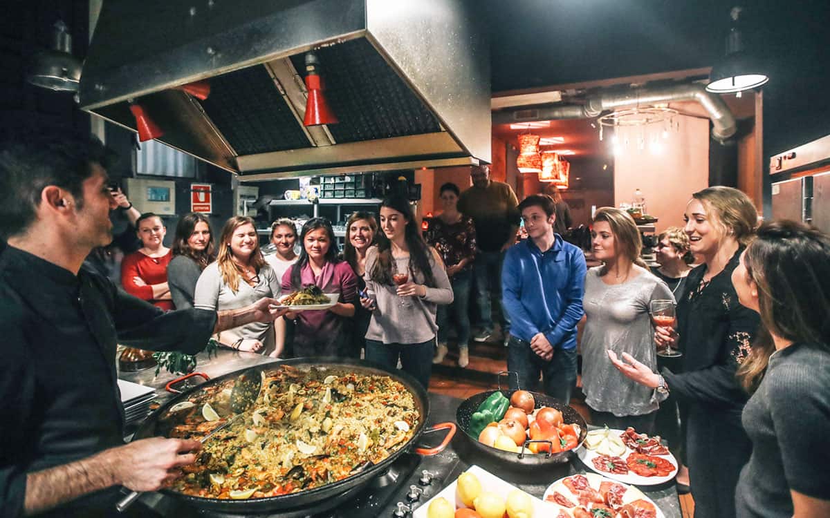 Visitors enjoying some food cooked by them.