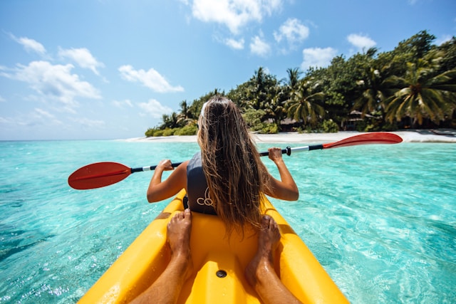 lady Kayaking in the waters off Railay beach, Krabi - places to see in Krabi