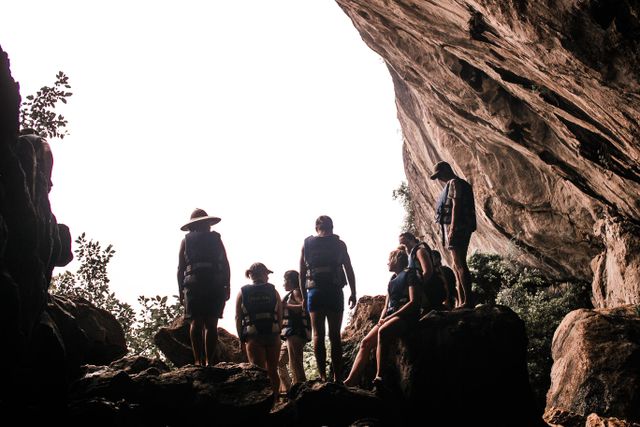 Tourists getting ready to climb stairs to enter the cave.
