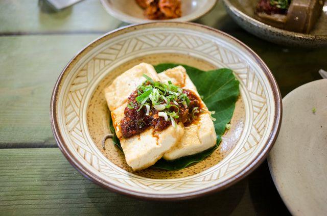 restaurants serving different versions of mapo tofu with different types of meats.
