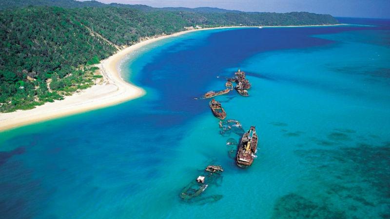 Tangalooma Wrecks (a cluster of shipwrecks) under clear waters. 