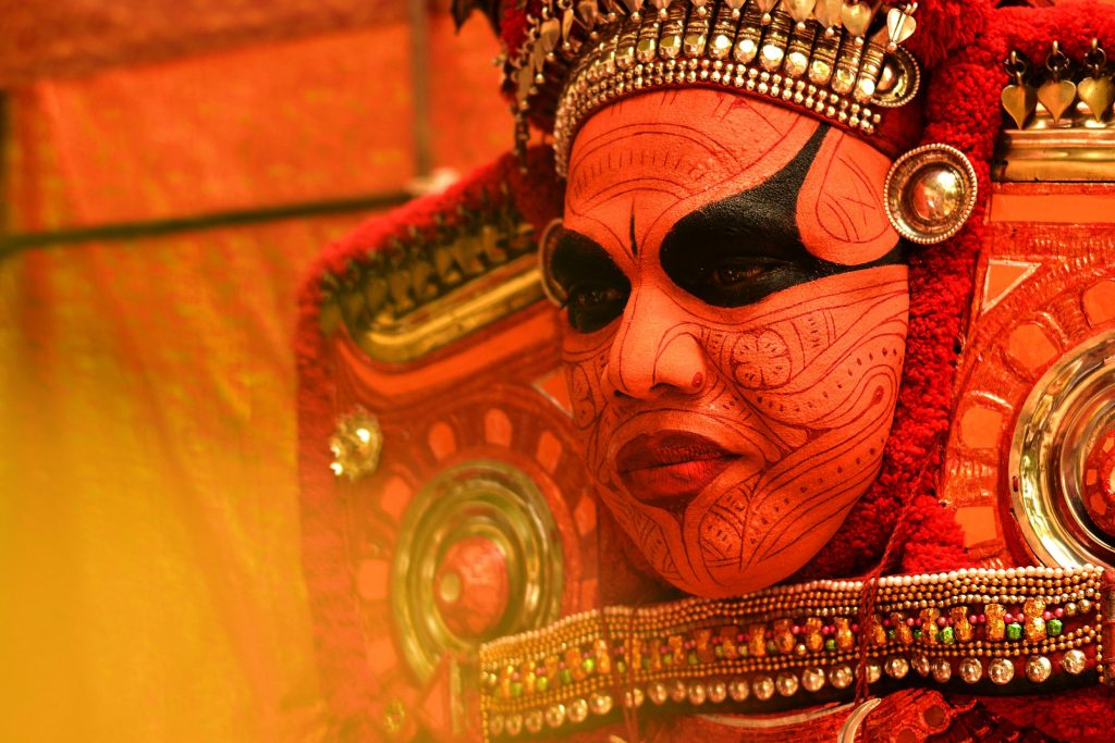 Men get dressed in fierce costumes, with facial art, enormous headgear and ornaments