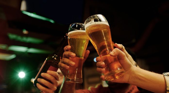friends toasting glasses of beer, (Image Source: Pexels) friends toasting glasses of beer