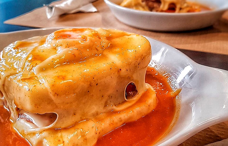 Portuguese sandwich made with ham, pork sausage, and steak or roast beef. 