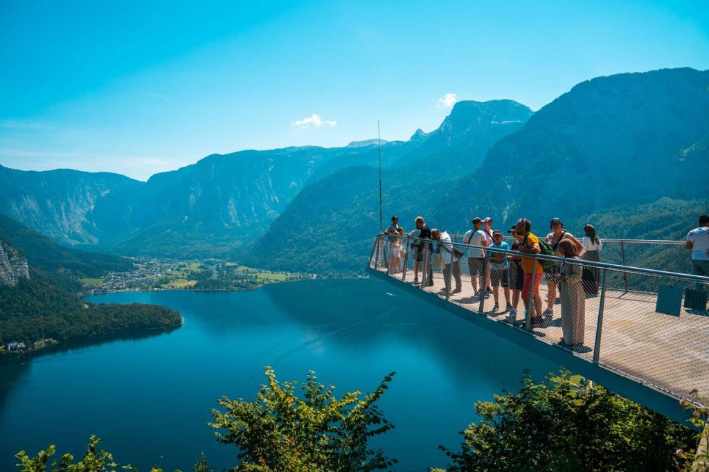 Tourists standing 350 meters above the beautiful town.