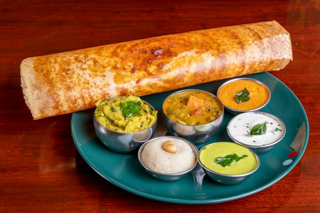 Mysore Masala Dosa served with sambar and chutney, selective focus