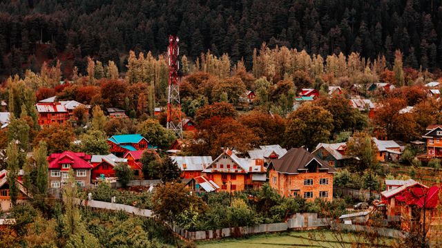 icturesque rural village in autumn, featuring colorful houses